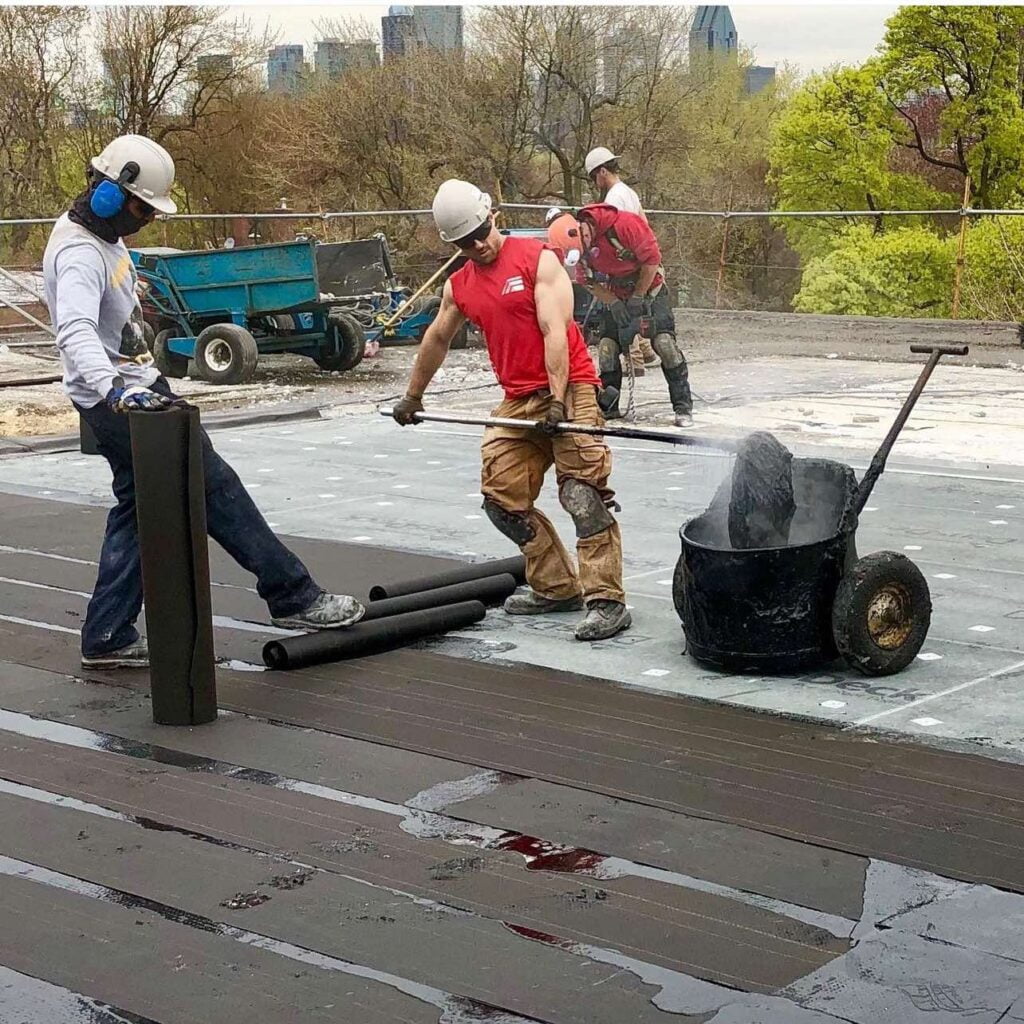 Alter Phase Roofing crew working on a EPDM Roof install in Brooklyn, NY