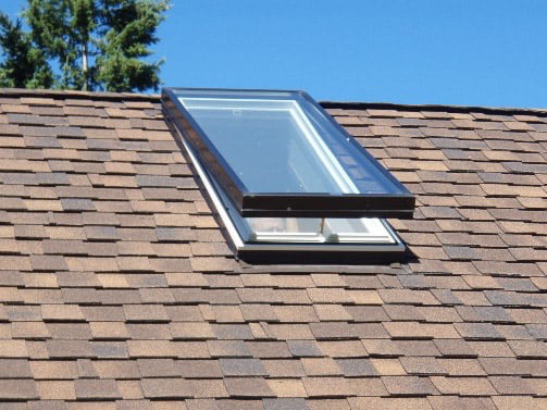 Skylight installed in a shingle roof